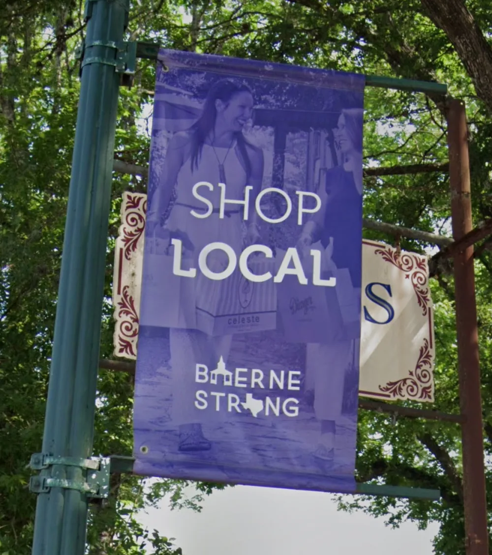 Shop Local Boerne Strong banner on Main Street